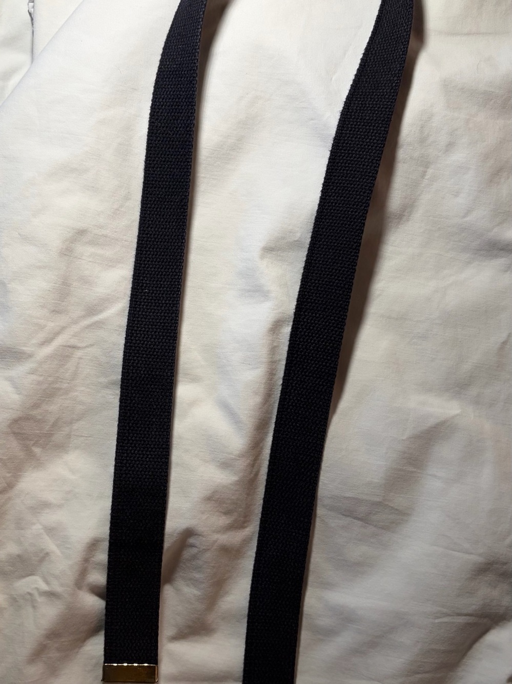 Black Men’s tweed belt with gold buckle.